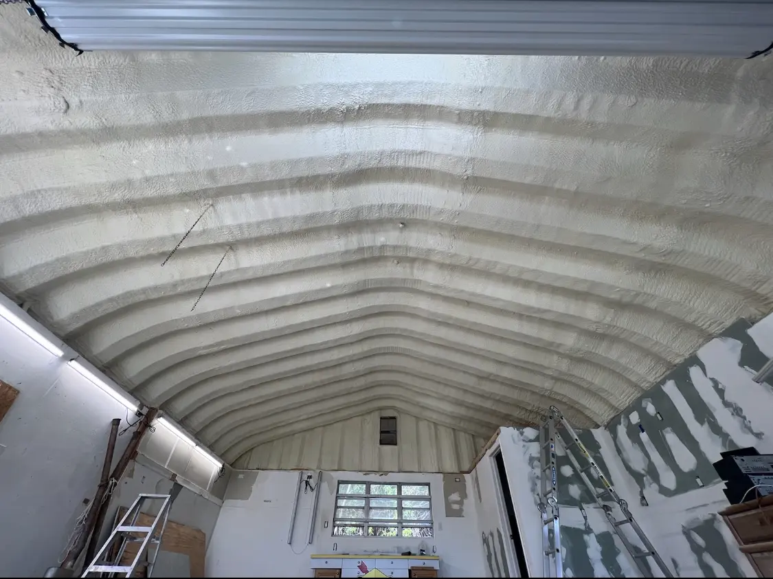 Spray polyurethane foam applied to the underside of a metal roof deck in Pompano Beach